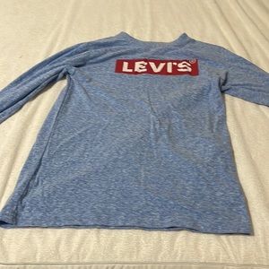 Levi’s the color is blue and the size is m